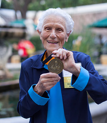 Iris Critchell holding medal