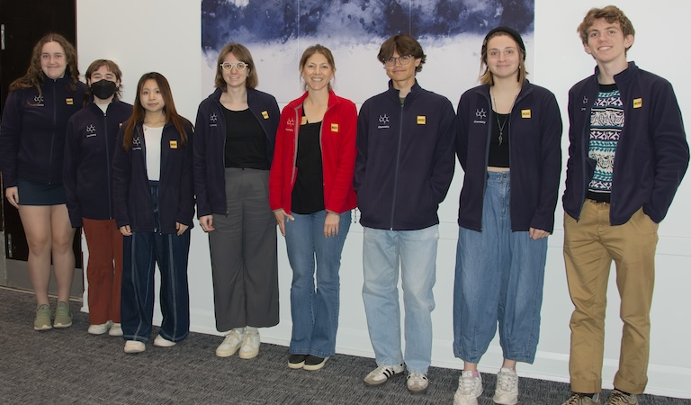 Junior majors received their navy color department jackets from Prof. Hawkins in a red jacket